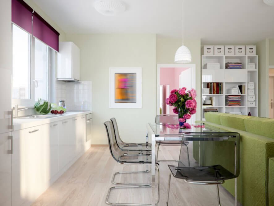 Pastel_Green_Kitchen_White_countertop_cabinets_clear_grey_table_chairs_pink_flowers_couch